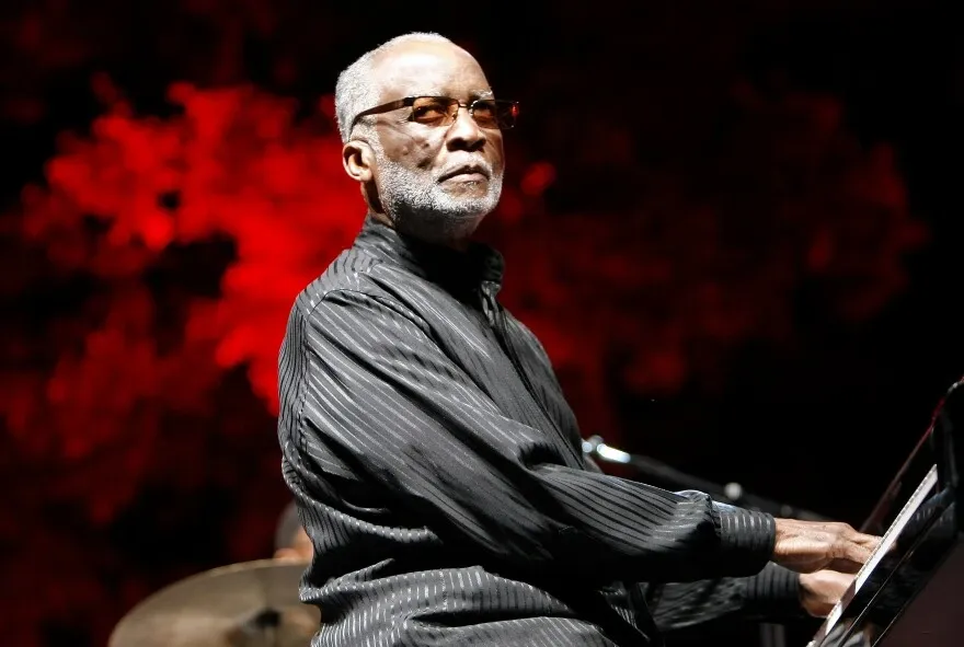 Ahmad Jamal playing the piano in a hall